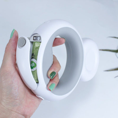 Hand holding white LED retractable leash snowman controller with clip and retractable line
