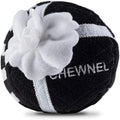Black plush squeak dog toy ball with white flower and CHEWNEL logo