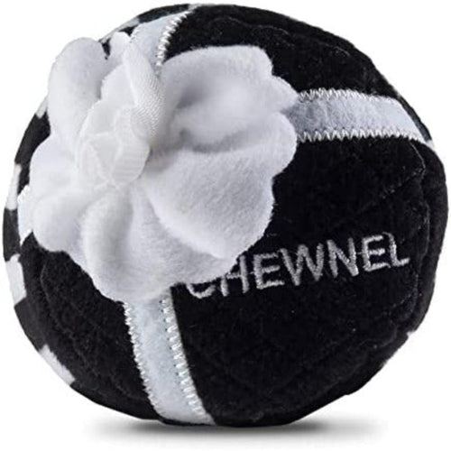 Black plush squeak dog toy ball with white flower and CHEWNEL logo