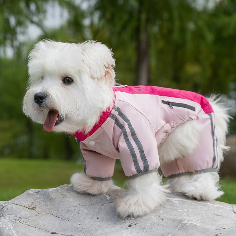 Pink dog winter puffer with fleece lining, black chest pocket, and reflective stripes