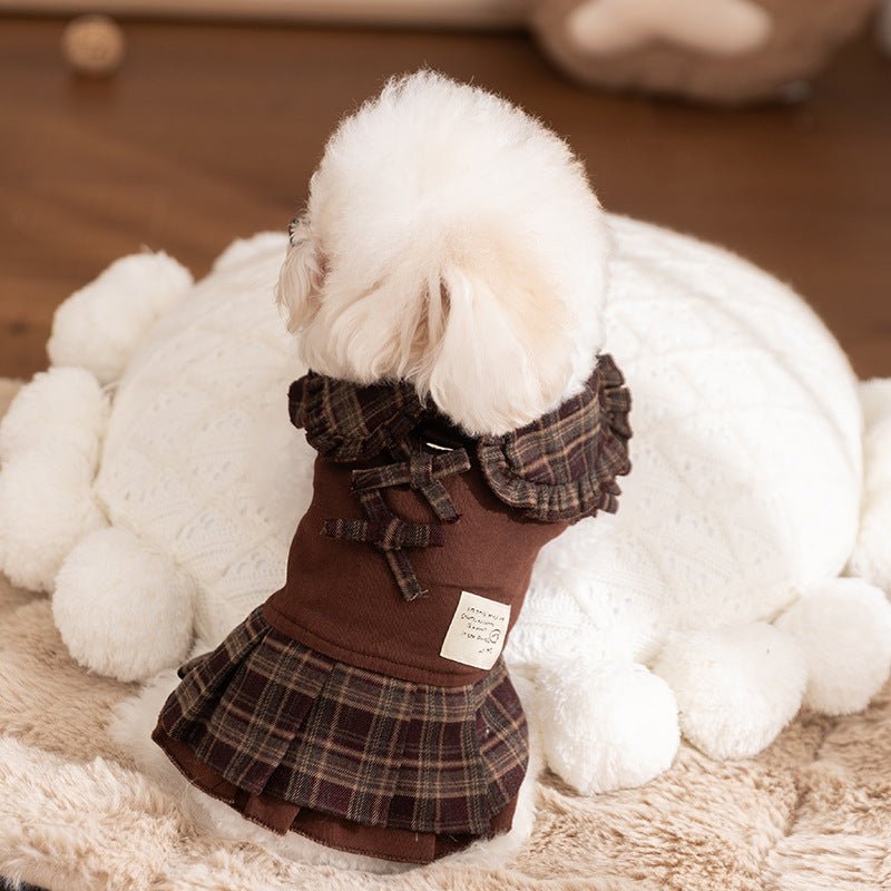 Brown dog skirt with plaid check ruffle collar and bow, worn by a small white dog