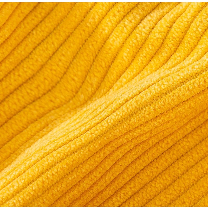 Yellow corduroy fabric texture with fine ridges.