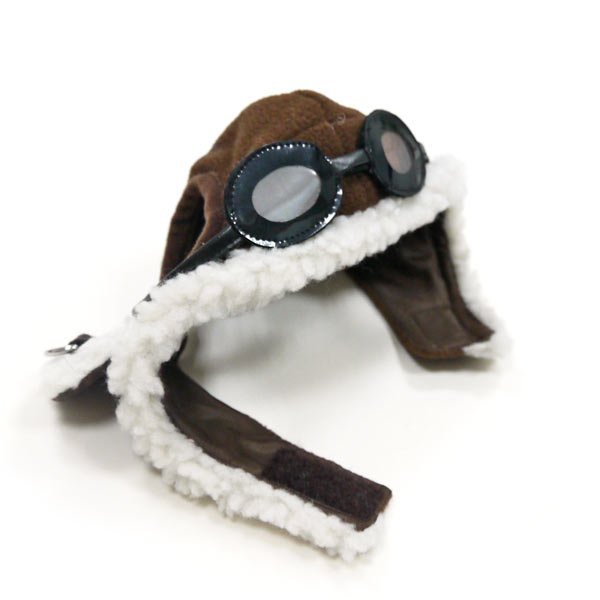 Brown aviator-style dog hat with white fleece trim and black goggles on top