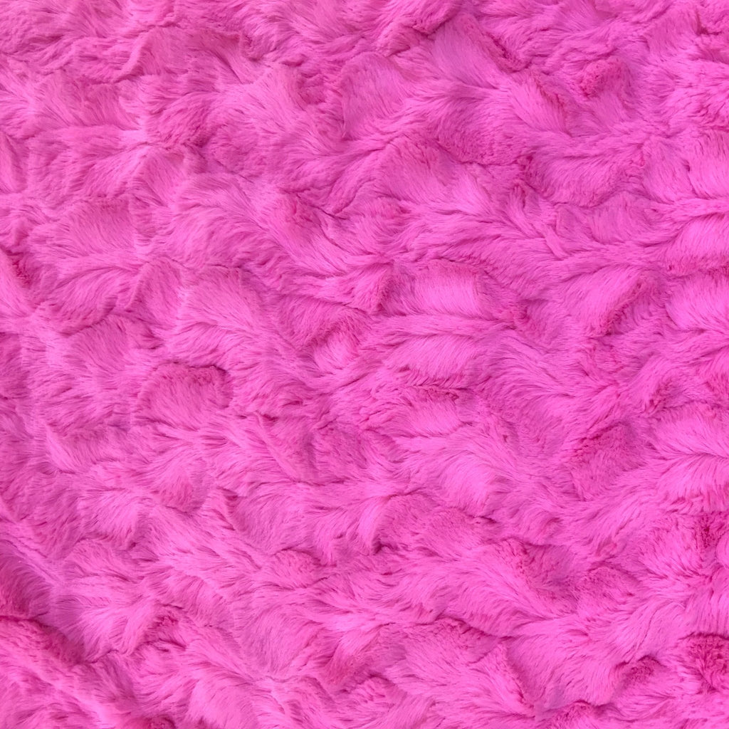 Hot pink plush blanket fabric close-up with crinkled pile texture