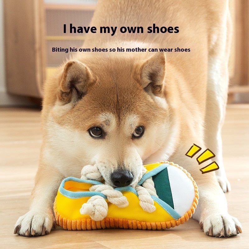 Shoe-shaped dog sound pet toy with braided cotton laces, teal strap and yellow sole.