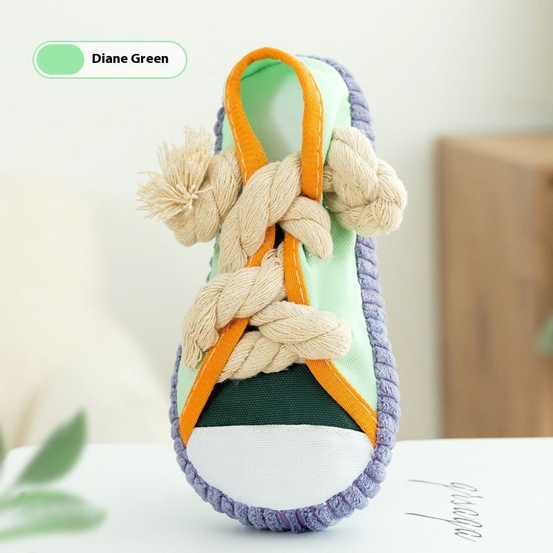 Diane Green shoe-shaped dog sound toy with braided cotton rope laces, green toe panel and orange trim.