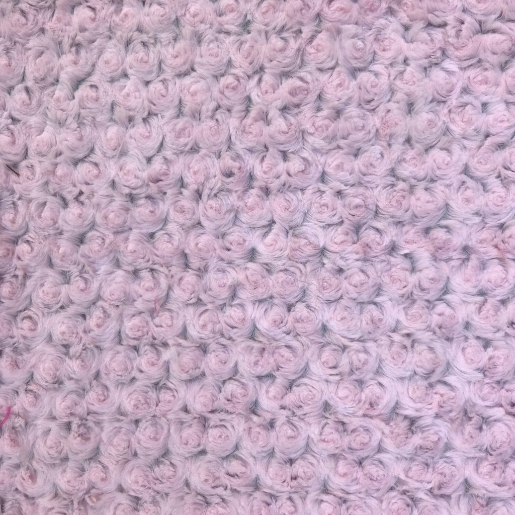 Crochet blanket texture with pale pink rosebud rosettes