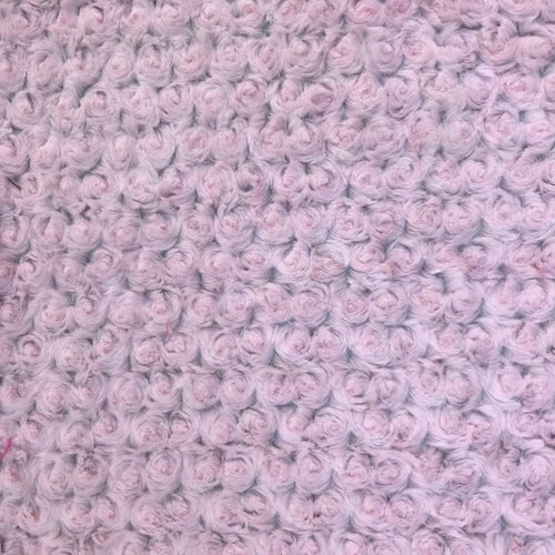 Crochet blanket texture with pale pink rosebud rosettes