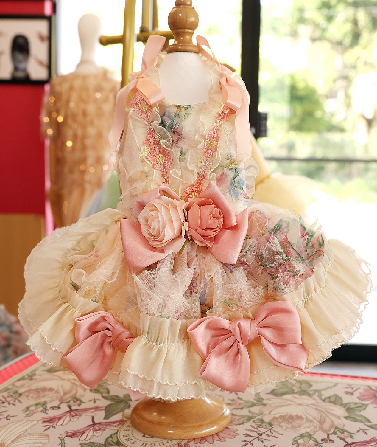 Princess-style dog dress with floral bodice, large pink rose bow, and ruffle skirt