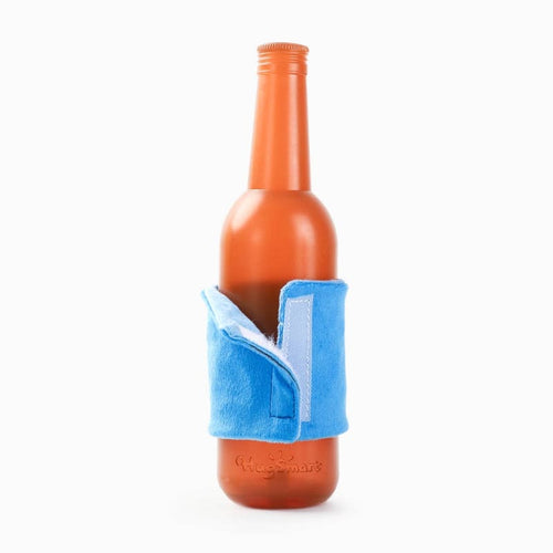 Orange rubber bottle dog toy with blue fabric carrier sleeve
