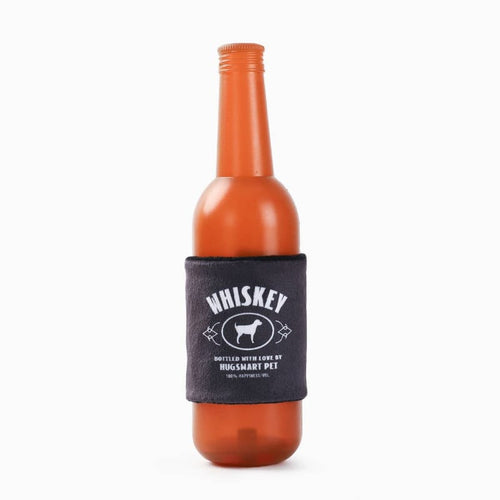 Orange rubber whiskey-bottle dog toy with black WHISKEY label and squeaker