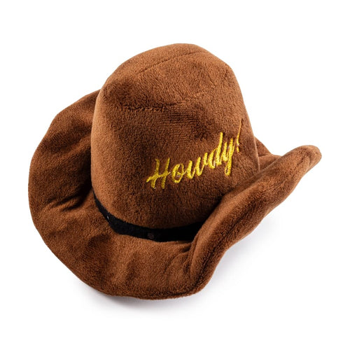 Brown plush cowboy hat dog toy with black band and yellow 'Howdy!' stitching