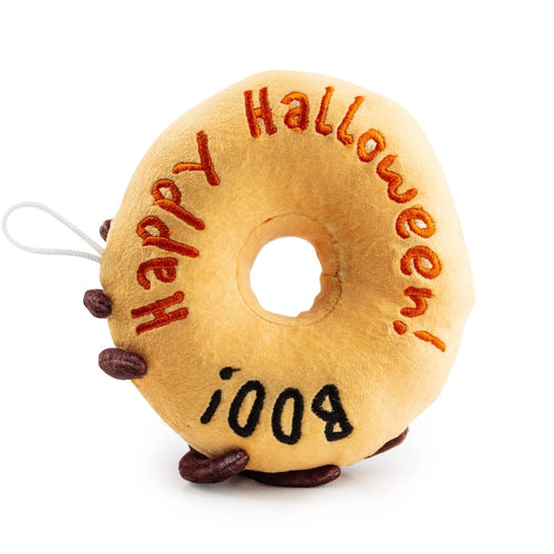 Plush donut dog toy with Halloween text and BOO, tan fabric, brown spider legs
