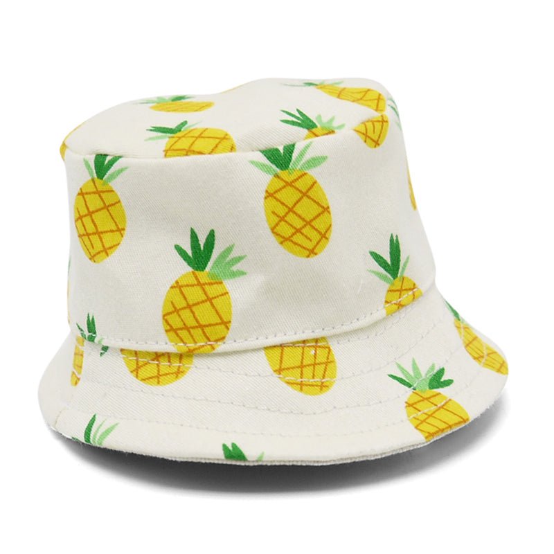 White bucket hat with yellow pineapples and green leaf pattern, side view