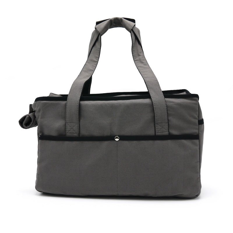 Charcoal tote bag with top carry handles and a front snap pocket detail.