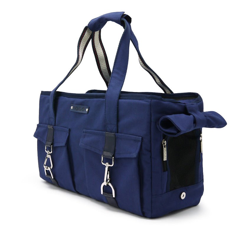 Blue tote bag with front pockets, side mesh compartment, and adjustable shoulder strap.