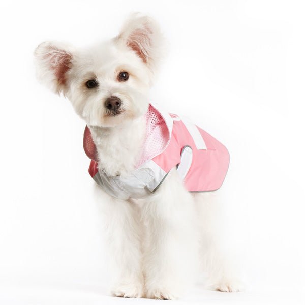 Pink and white dog raincoat with bunny hood and mesh-style interior, side view