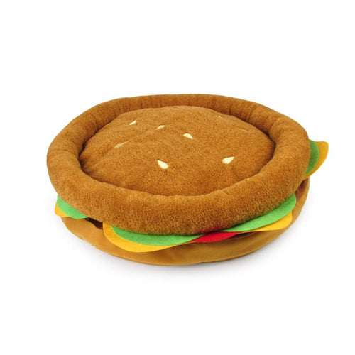 Burger-shaped plush pet bed, brown bun with green and yellow layered sides
