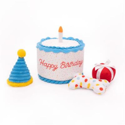 Plush birthday cake dog toy with candle, blue frosting, and rope bone pieces