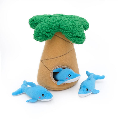 Plush dog toy palm tree with green top, tan body, and three blue dolphin plushes