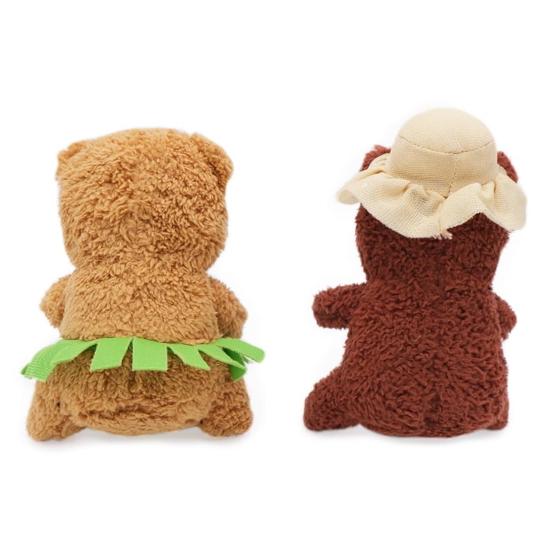2-pack plush dog toys, back views: tan toy with green bandana, dark brown with hat
