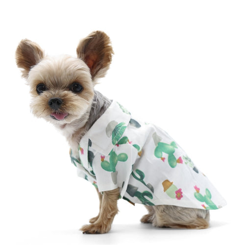 White dog shirt with green cactus and succulent print, short sleeves, button-front collar.