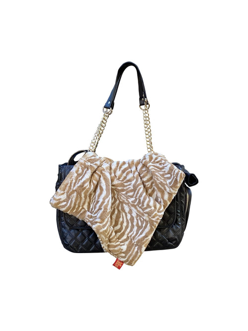 Zebra-pattern square pet blanket with fuzzy tan edge trim, draped over carrier
