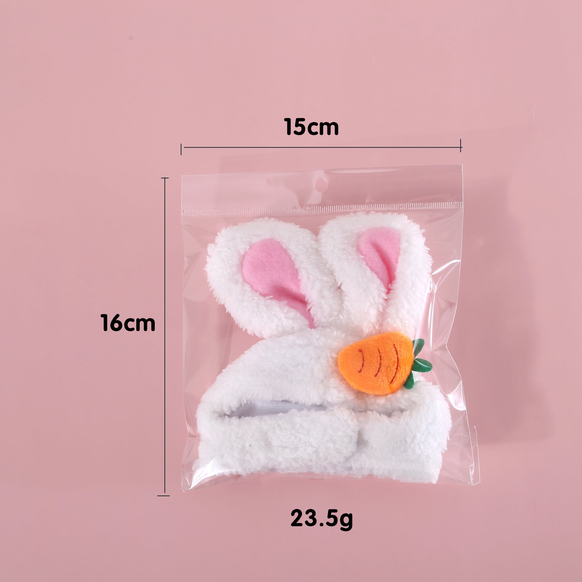 Packaged white plush bunny-eared Easter hat with carrot patch, size shown