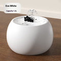 White ceramic pet water fountain with cartoon cat spout, full body view on tabletop