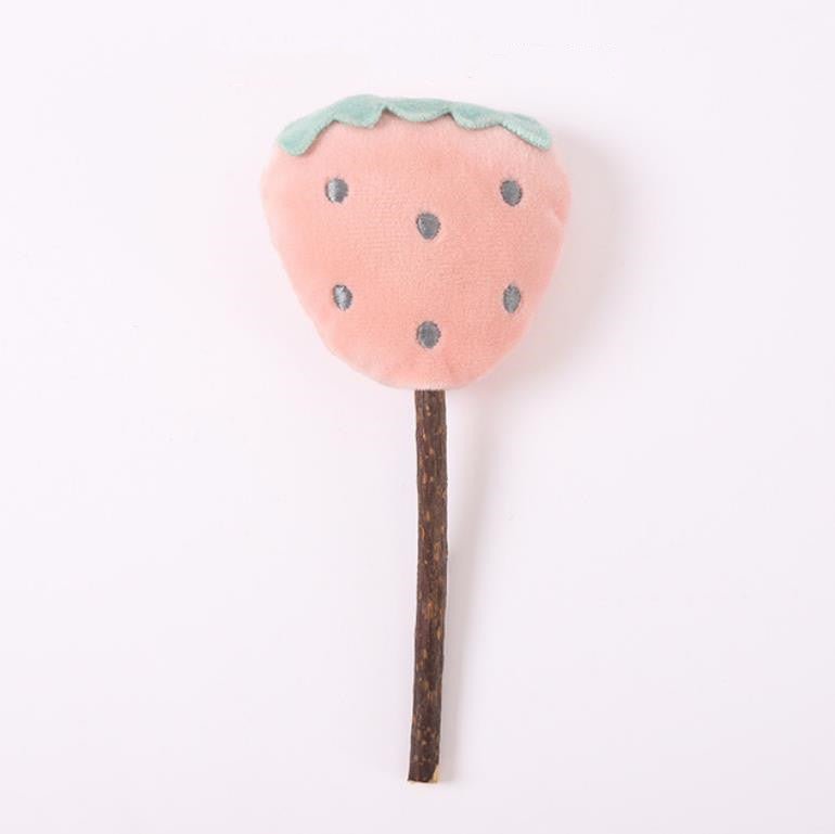 Pink strawberry-shaped plush catnip teasing stick toy on a wooden handle