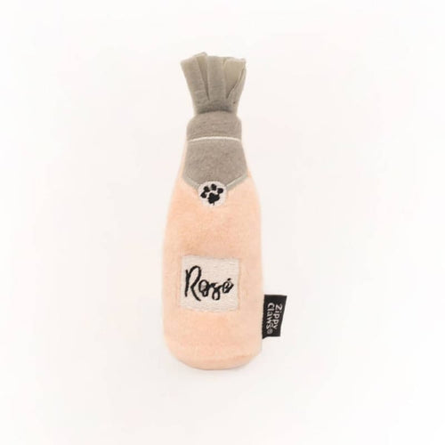 Plush cat toy shaped like a rosé bottle in pink and gray with a paw patch
