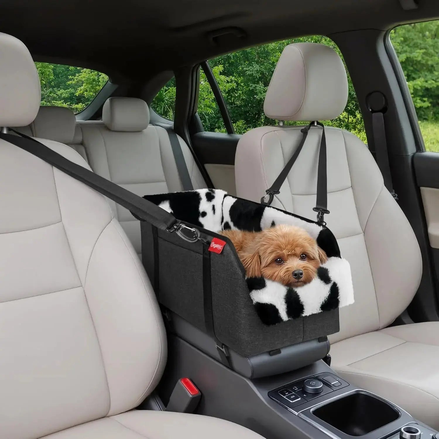 Grey dog booster seat on car center console with small dog on the plush pillow