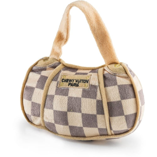 Plush checkered handbag dog toy with rounded bottom, two handles, front logo patch