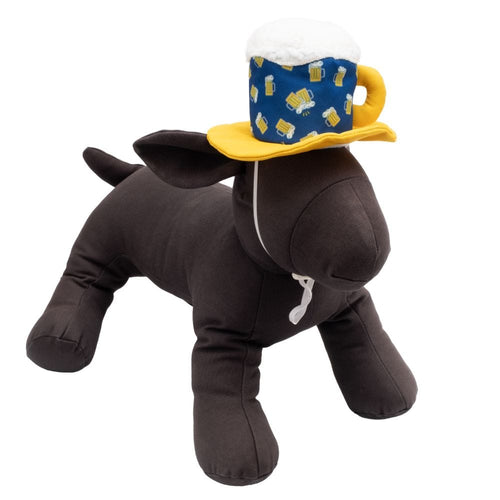 Dog wearing beer-themed pet hat: blue patterned cup, white fuzzy top, yellow brim