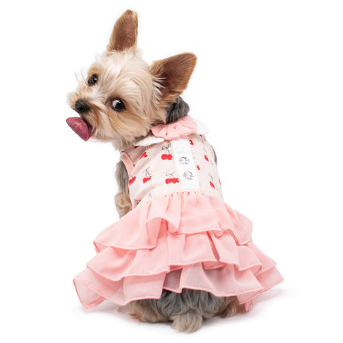 Pink cherry print pet dress with layered ruffled skirt and bow at the collar