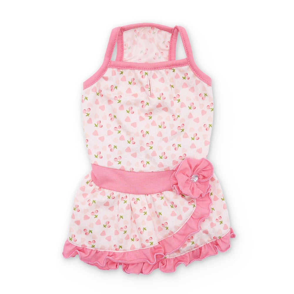 Pink heart-print pet dress with sleeveless cut, pink waistband, and ruffled hem
