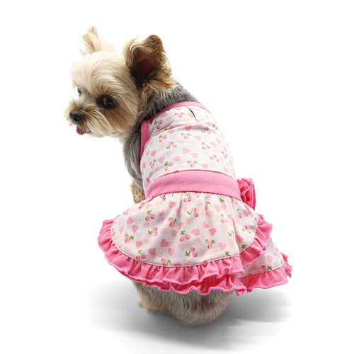 Pink heart-print pet dress with pink trim and layered ruffled skirt