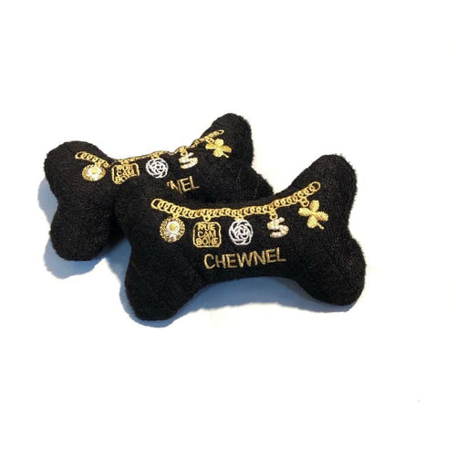 Black plush bone-shaped dog squeak toy with gold chains and Chewnel lettering