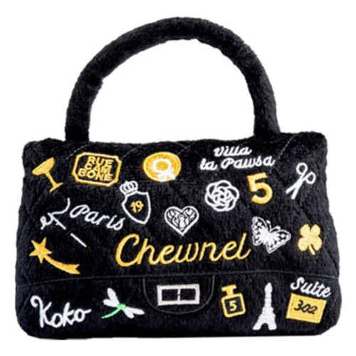 Black plush purse-shaped squeak dog toy with embroidered icons and hearts