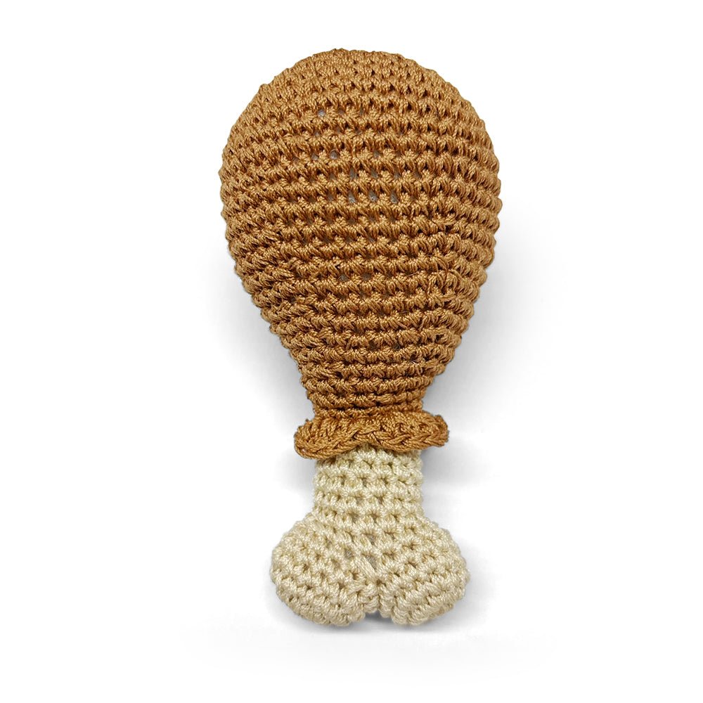 Crocheted chicken leg toy with brown top and beige body, plush knit texture