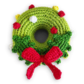 Crochet wreath toy with green round crochet, red bow, berries, and white holly