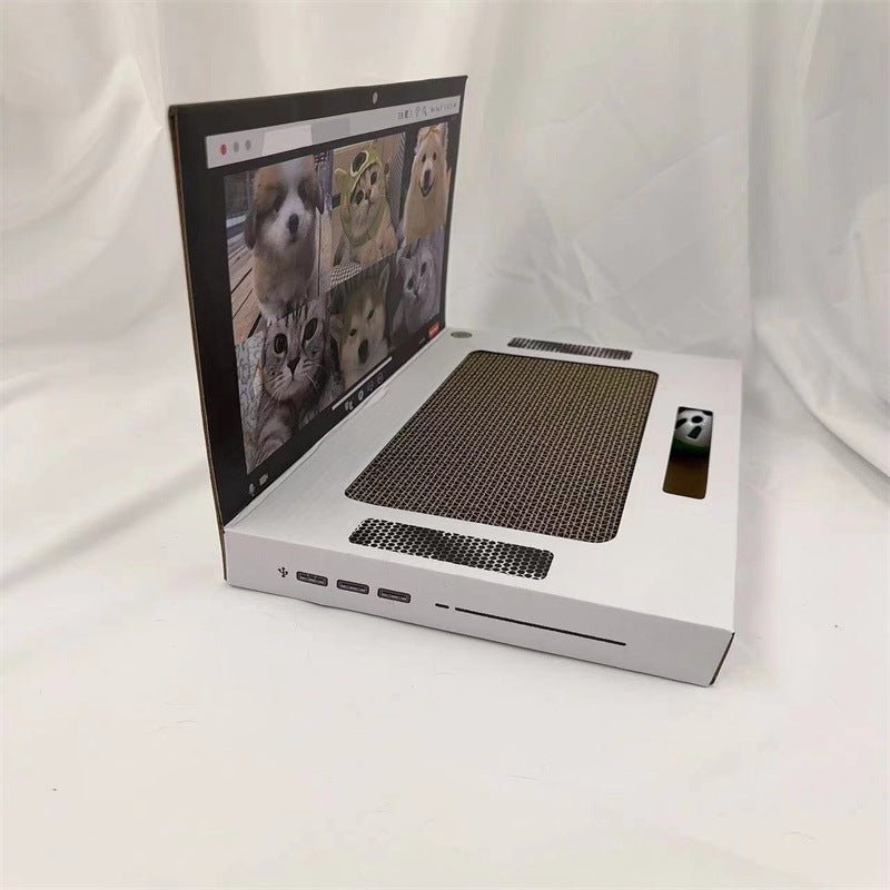 White laptop-style cat scratch board with dark textured scratching mat and side accessory slot