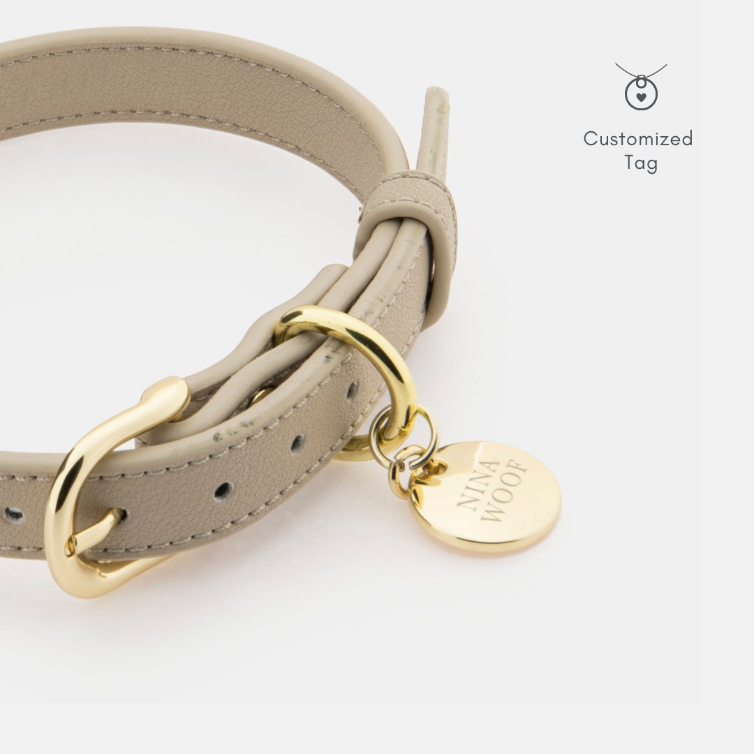 Beige vegan leather dog collar with looped buckle and round engraved tag
