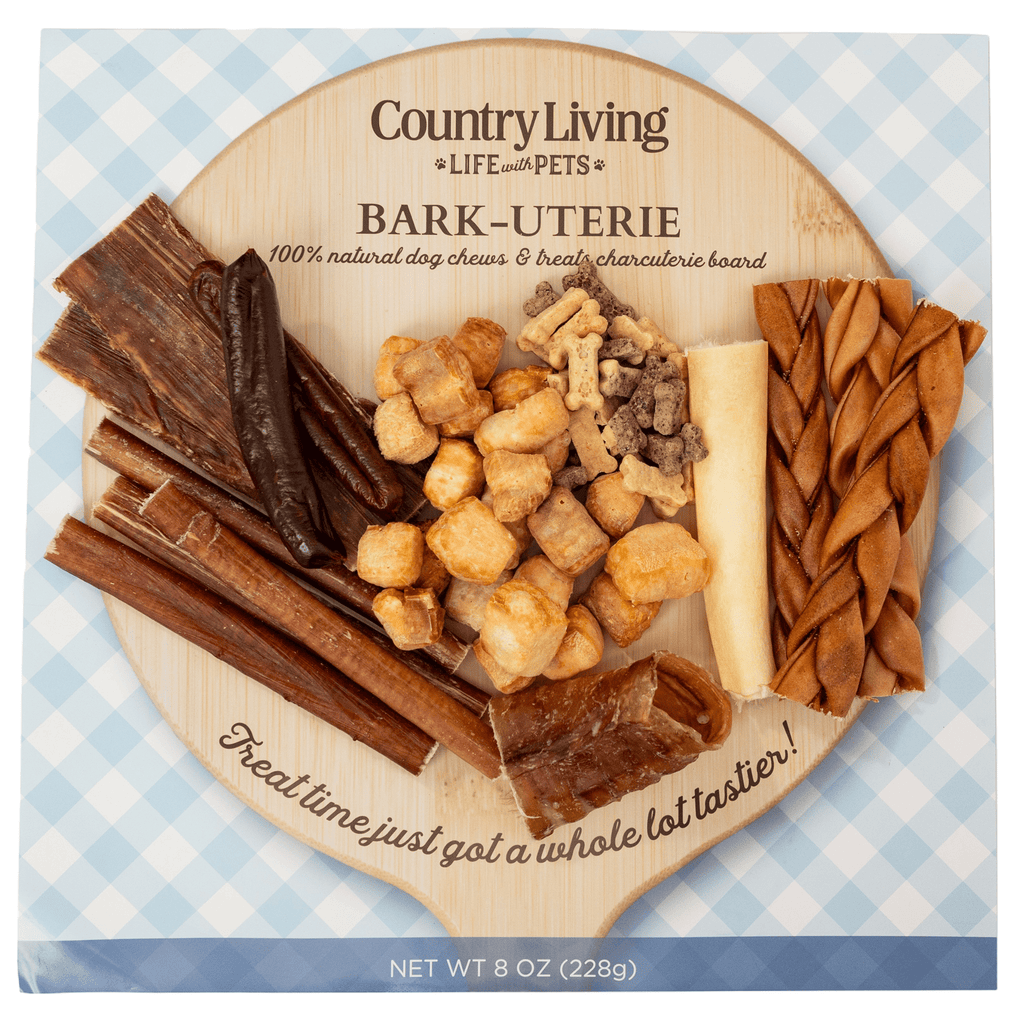 Assorted bark-themed natural dog treat assortment on round wood-style tray