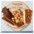 Assorted bark-themed natural dog treat assortment on round wood-style tray