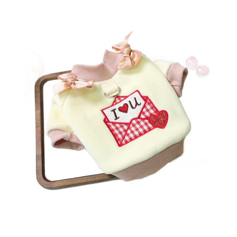 Cream pet T-shirt with pink ribbed trim, neck bow, red plaid envelope heart applique