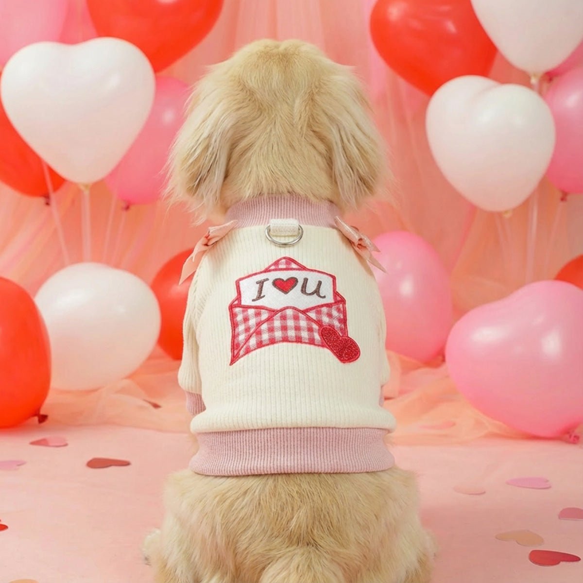 Cream dog T-shirt with pink ribbed collar and cuffs, bow detail, envelope patch with heart