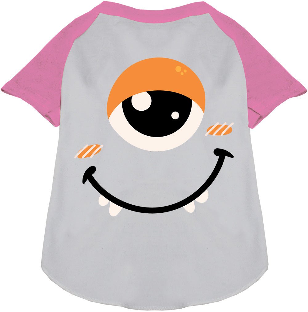 Light grey pet raglan shirt with bright pink raglan sleeves and monster face graphic