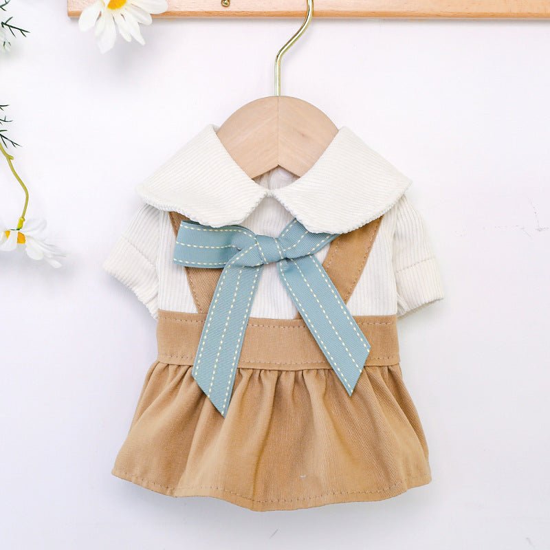Khaki pet dress with white collar and light blue bow, on wooden hanger
