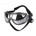 Dog anti-UV goggles with black elastic strap and clear gray-tinted lenses